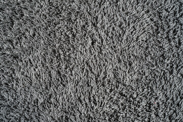 Gray background from microfiber fabric, idea for wallpaper or screen about materials. Synthetic matter