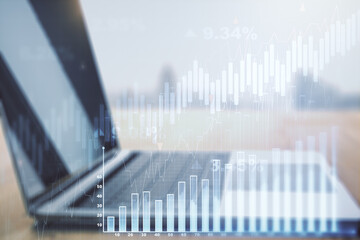 Abstract creative financial graph on modern laptop background, forex and investment concept. Multiexposure