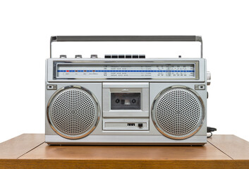 Vintage boombox on wood table with cut out background