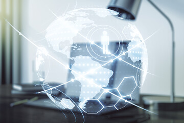 Social network concept with world map and modern laptop on background. Multiexposure