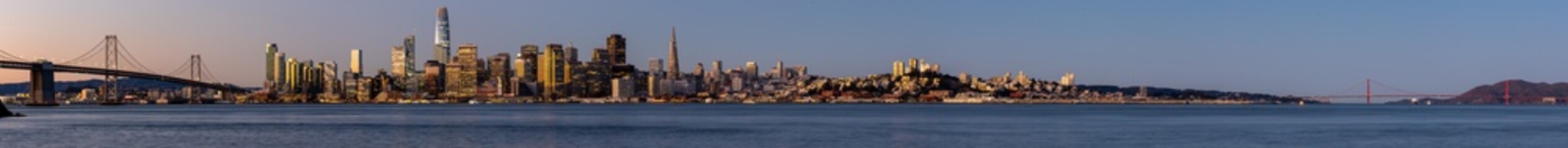 Fototapeta na wymiar View of the Bay Bridge and San Francisco skyline at dawn from Treasure Island