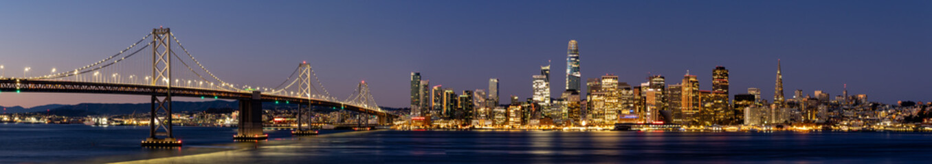 Fototapeta na wymiar View of the Bay Bridge and San Francisco skyline at dawn from Treasure Island