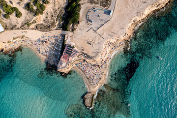 Aerial photographs of the beaches of Cala Conta and Cala Escondida, on the island of Ibiza during a sunny summer day with blue sky and turquoise water
