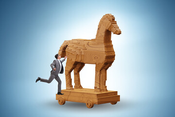 Fototapeta premium Businessman and trojan horse in trap concept