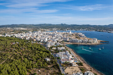 Fototapeta premium Aerial photographs of San Antonio, in the island of Ibiza during a sunny summer day with blue sky and turquoise water