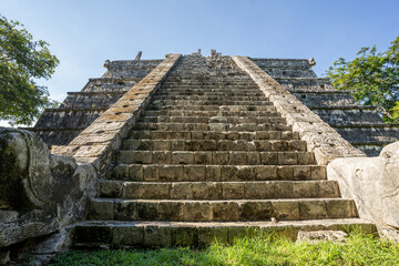 The ruins of a beautiful pyramid in the archaeological zone of Chichen Itza in Mexico.