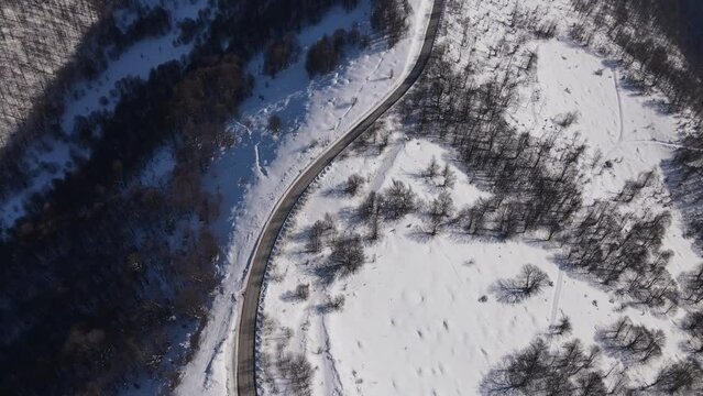 Old Mountain Balkan Stara Planina Babin Zub tourist resort in winter day covered with snow empty road