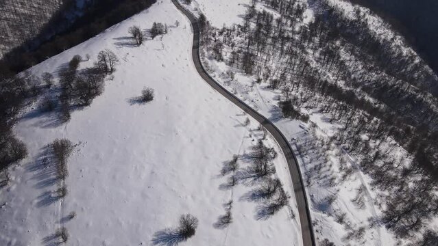 Old Mountain Balkan Stara Planina Babin Zub tourist resort in winter day covered with snow empty road