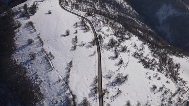 Old Mountain Balkan Stara Planina Babin Zub tourist resort in winter day covered with snow empty road