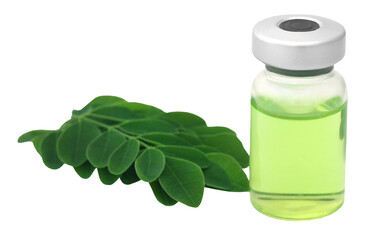 Moringa leaves with extract in a vial