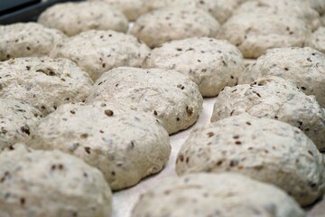 preparations of grain bread are on the table. baker at work. The baker shapes the bread. Hands on the close-up foruyut bread	