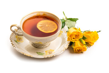 Porcelain cup with tea and yellow roses on a white background. Isolate