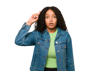 Young african american curly woman isolated having some great idea, concept of creativity.