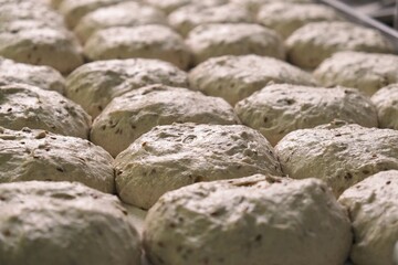 preparations of grain bread are on the table. baker at work. The baker shapes the bread. Hands on the close-up foruyut bread	
