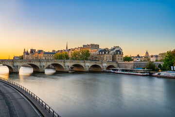 Pont Neuf bridge over the River Seine at sunrise in Paris.