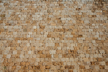 Fragment of a stone wall in the fortress of the city of Dubrovnik. Croatia.