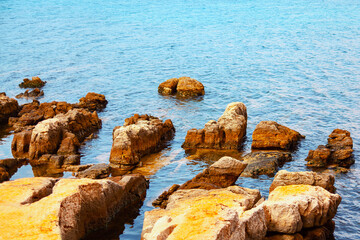 Fototapeta na wymiar Ocean rocks in turquoise water . Rock formation in the sea