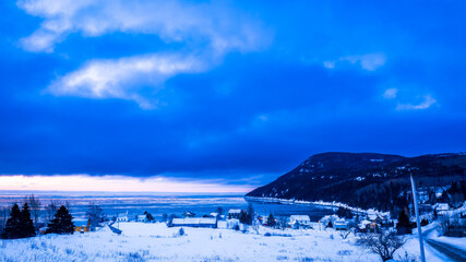 Obraz premium Charlevoix, the small village of Port-au-Persil, pitoresque between hills and St. Lawrence River.