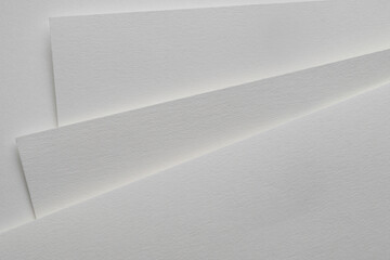 Blank watercolor paper sheets on white background, top view