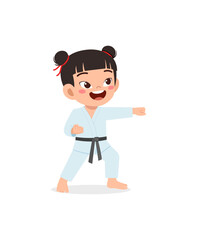 cute little kid training and showing karate pose