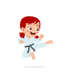 cute little kid training and showing karate pose