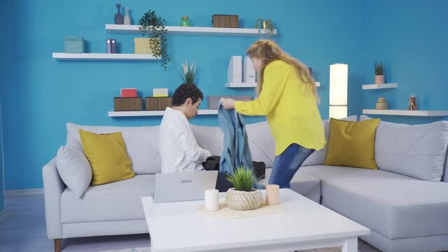 His mother helps the young man who is late for school.
Mother helps her son to get to school.
