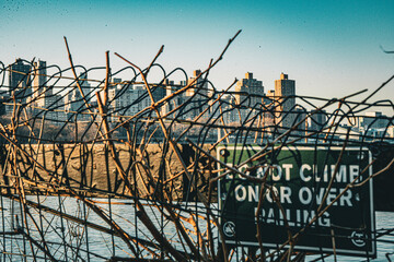Fence with NYC in the background at sunset
