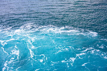 Obraz premium Turquoise sea water . Splashing sea water background
