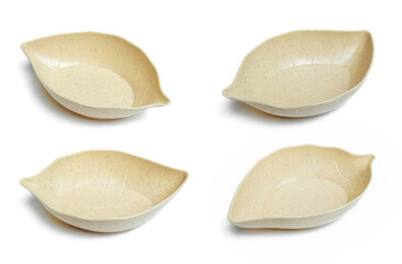 a serving bowl in the shape of a leaf isolated on white background