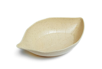 a serving bowl in the shape of a leaf isolated on white background