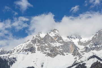 Fototapeta na wymiar Beautiful snowy winter landscape around Ramsau and mount dachstein in austria