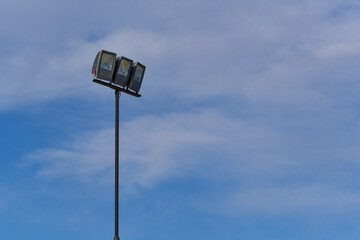 beach lamppost on background of blue sky with clouds