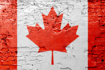 graffiti of national flag of canada painted on the rusty wall