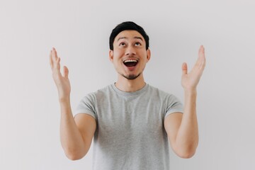 Surprised shocked face asian man isolated on white background for advertisement.