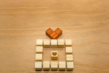ギフトボックスの形をしたウッドキューブがある木目の背景