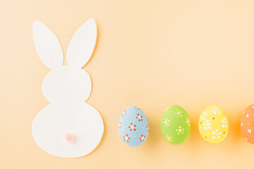 Easter eggs bunny and rabbit white paper cutting isolated on pastel background. Funny decoration, Happy Easter Day, Festive composition banner design holiday background