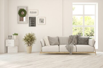 White living room with sofa and summer landscape in window. Scandinavian interior design. 3D illustration