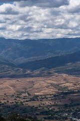 Fototapeta premium Beautiful view of the large Mexican city of Oaxaca from Monte Alban. View of the endless mountain peaks.