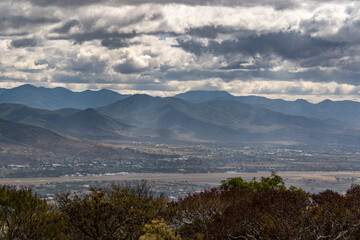 Beautiful view of the large Mexican city of Oaxaca from Monte Alban. View of the endless mountain peaks.