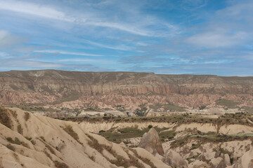 Fototapeta na wymiar Panoramic view of the Cappadocia valley with rocky mountains.