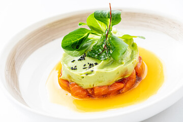 salmon tartare on the white plate