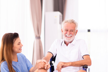 Senior men sitting on wheelchair with nurse take care in a nursing home