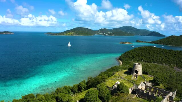 Sailing by Sugar Plantation on US Virgin Islands, St John thru turquoise waters and sandbars within the St John National Park