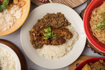 Lentils with fish egg cup and rice Peru traditional comfort food buffet table