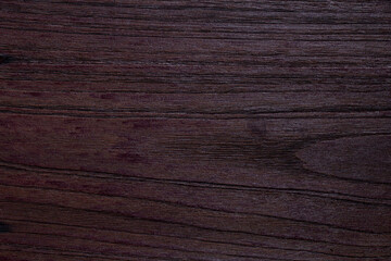 Fototapeta premium The surface of the wood painted in dark oak color for background and has a beautiful grain.