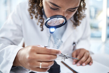Science, magnifying glass and and woman with microchip for inspection, repair and maintenance in...