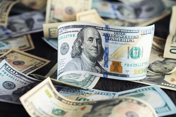 Money, US dollar bills background. Money scattered on the desk. Photography for Finance and Economy...