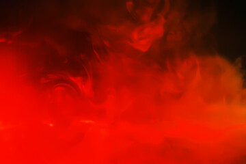 Red smoke over black studio background. Red steam on a black background. Copy space.