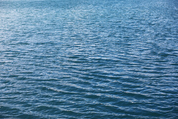 Water surface. The texture of the water. Waves on the lake in windy weather.