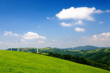 a hill with a wind generator